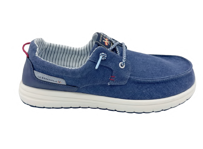 Zapatilla tipo sneaker azul marino para hombre con tejido de lienzo y detalles sintéticos, interior rayado y suela blanca cómoda, estilo casual y moderno.