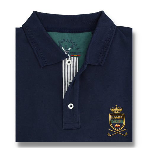Polo hombre azul marino de algodón y elastano con detalles en verde pálido, cuello clásico y bordado distintivo en pecho, ropa masculina premium de calidad.